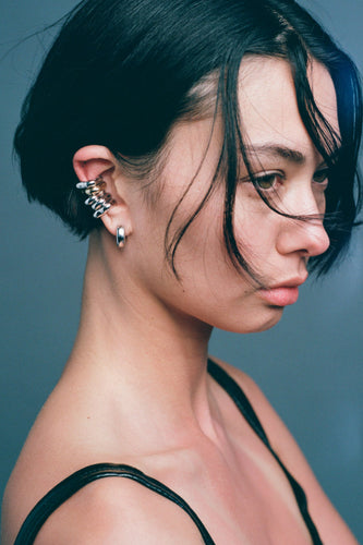 FF Ear Cuff in 925 silver stacked up the ear with additional cuffs and a hoop.