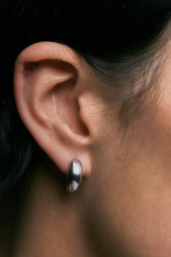 Onion Earrings in 925 silver, close view of the domed hoop on the ear.