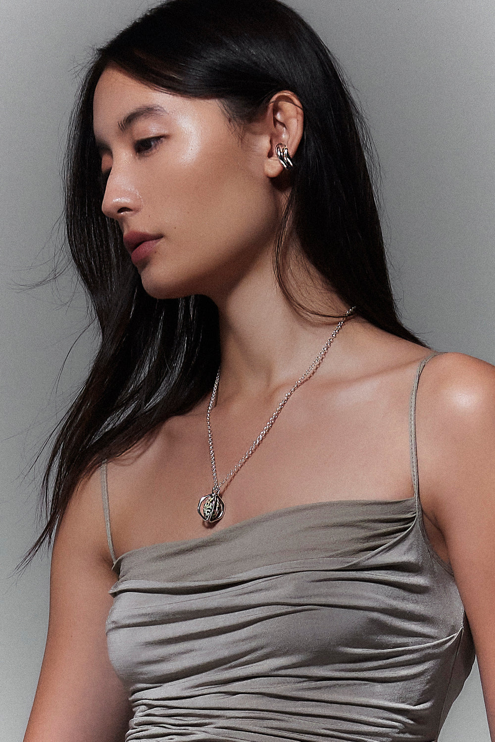 Model wearing INO Mushroom Ear Cuff and Quail Egg Necklace in silver