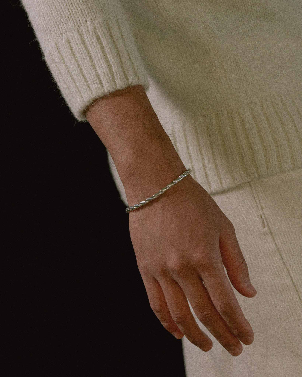 model wearing eight bracelet in solid 925 sterling silver