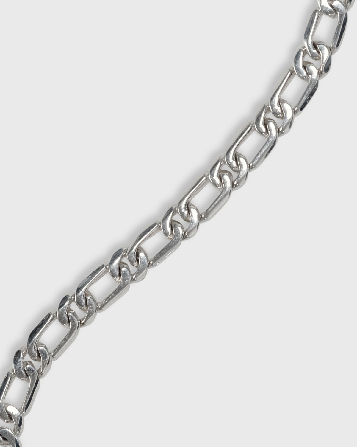 close up of figaro bracelet in solid 925 sterling silver