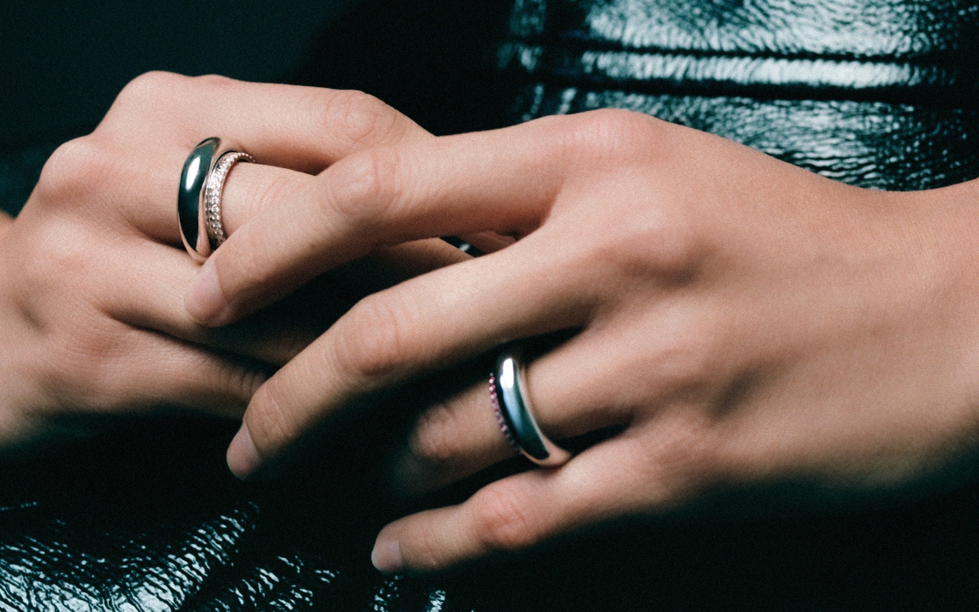 Hands wearing INO rings